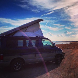 Our Mazda Bongo camper van parked up on the beach