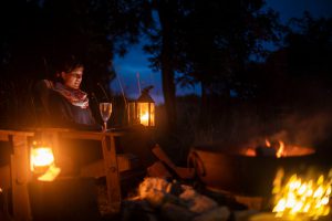 Sat by the fire pit while glamping in a shepherds hut at Warmwell House in Dorset