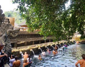 People bathing in the holy water at Tirta Empul, Bali.