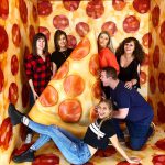 Inside Eye Candy, Toronto with a giant pizza!