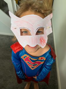 Emily wearing her homemade Owlette mask