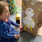 Bop bop the alien on the side of our cardboard rocket