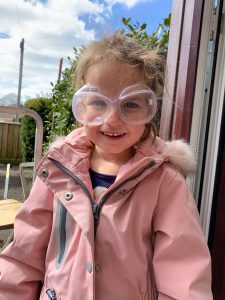 Emily wearing safety goggles for our volcano experiment
