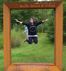 Me jumping in mid air at Sculpture by the Lakes in Dorset