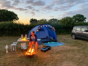 Sat by the firepit at Harry's Field campsite in the New Forest